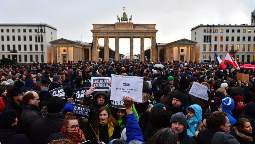 People rally near Berlin's Brandenburg Gate