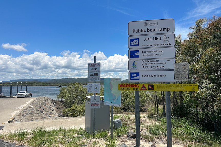 A warning sign about crocodiles at a fishing spot