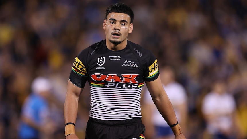 A Penrith Panthers NRL player walks off the field during a 2022 match.