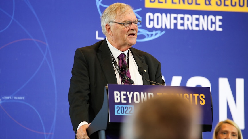 Kim Beazley addressing conference delegates from the podium.