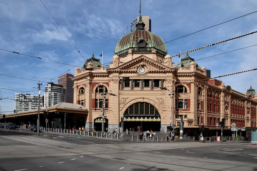 The empty intersection outside Flinders St station in Melbourne.