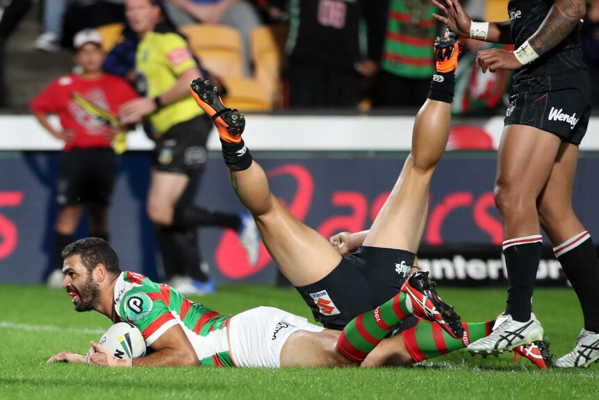 Greg Inglis on the ground after scoring a try for the Rabbitohs against the Warriors.