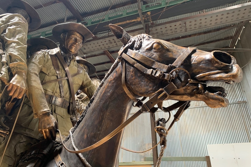 A bronze statue of 'Bill the Bastard' and his rider Terry Shanahan shows the horse with an open mouth