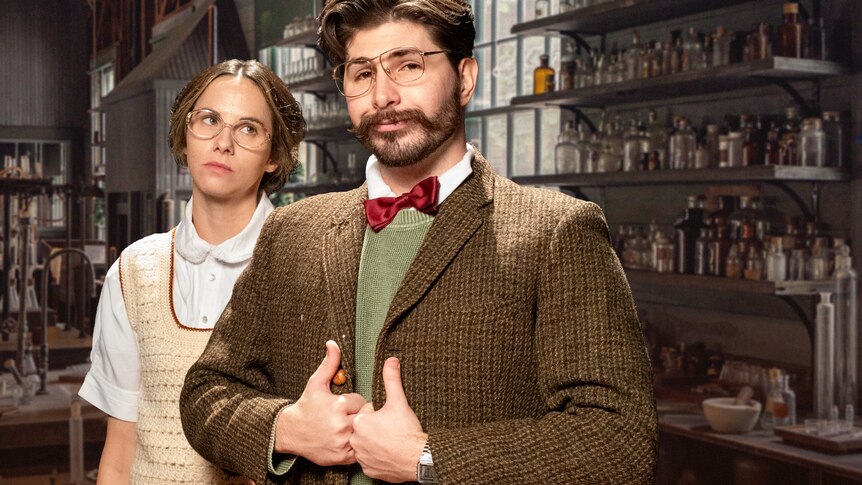 Justina looks disapprovingly at a smug Joe as they role play scientists working in the 30s.