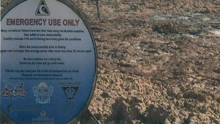 An emergency life ring and warning signs about the dangerous conditions at Quobba Station.