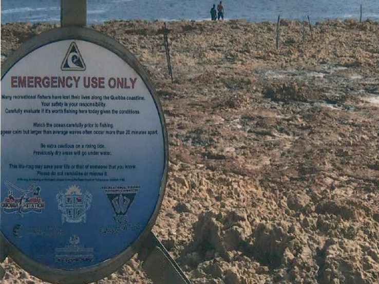 An emergency life ring and warning signs about the dangerous conditions at Quobba Station.