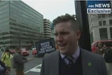 Richard Spencer stands in front of the camera being interviewed by Zoe Daniel.