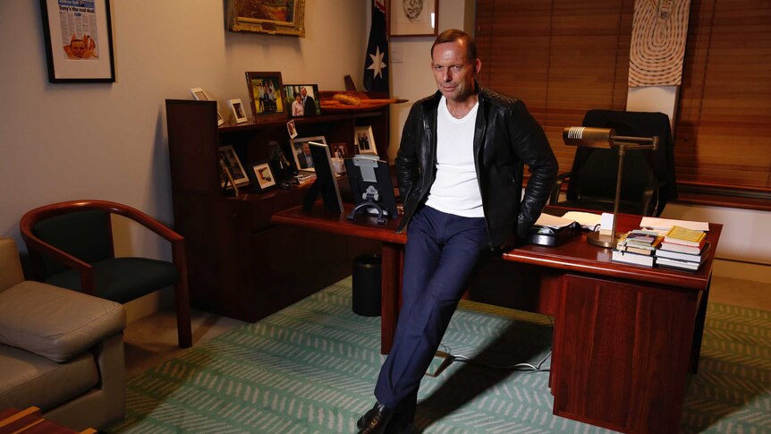 Tony Abbott models his kangaroo-skin leather jacket in his office in Parliament House.
