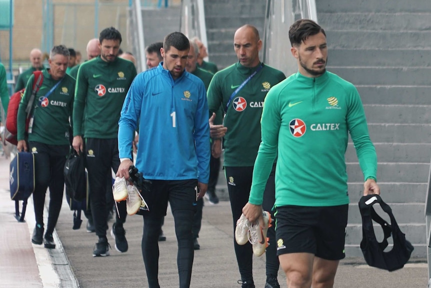 The Socceroos walk to train in Kazan, Russia.