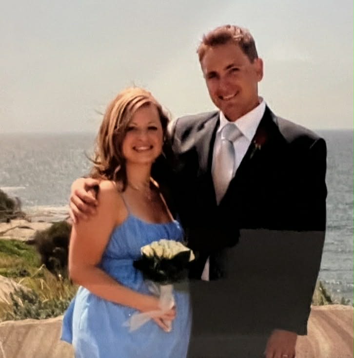 two people in formal wear smiling