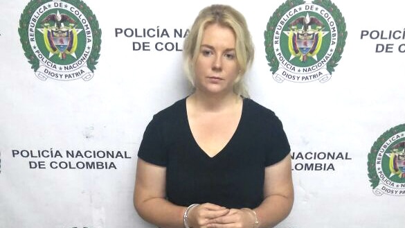 Australian woman Cassie Sainsbury in handcuffs after she was arrested at the international airport in Bogota