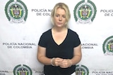 Australian woman Cassie Sainsbury in handcuffs after she was arrested at the international airport in Bogota