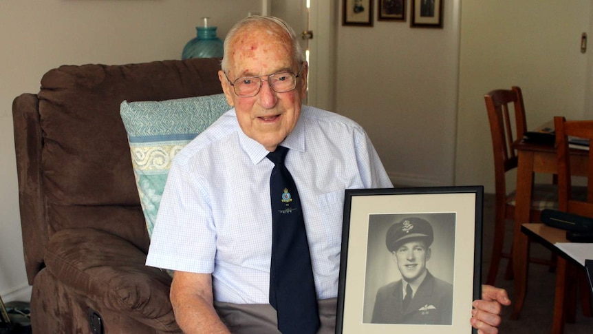 Dr Edward Fleming with his WWII  photo, Canberra, March 2018.