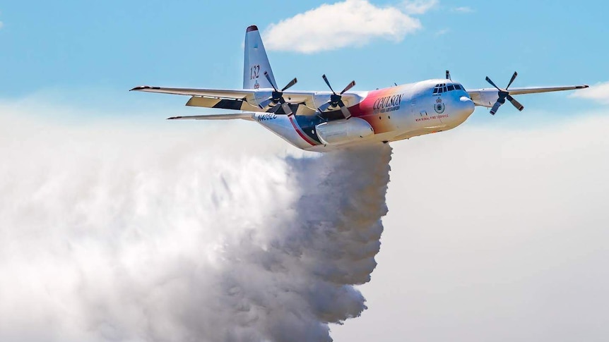 A C-130 air tanker flies