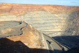 Close up of Super pit in Kalgoorlie from edge with truck driving along