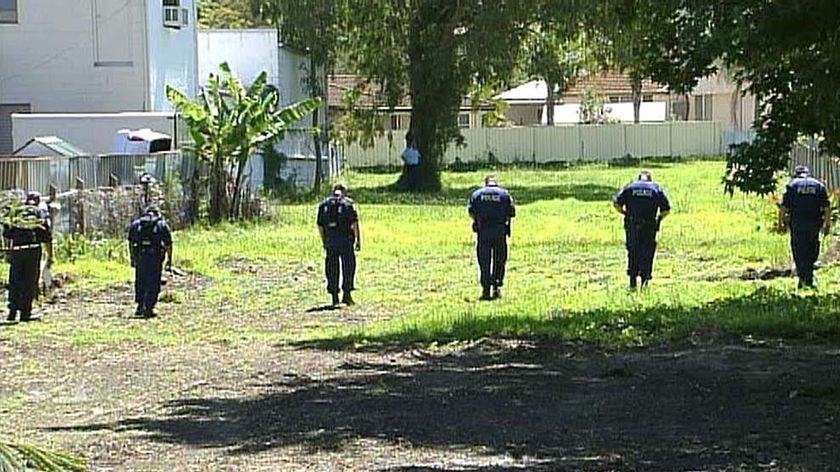 Police search a vacant block of land at Belmont