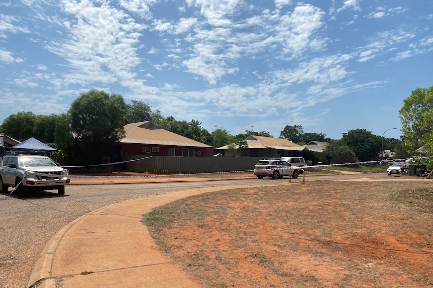 Police tape across a suburban road in Broome