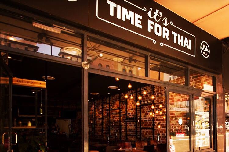 the exterior of a restaurant which reads it's time for thai