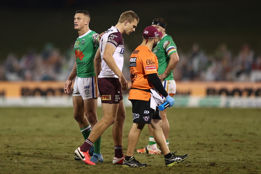 Rugby league player walking off the field after getting injured during a game