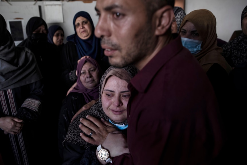 A woman mourning the death of family members in Gaza