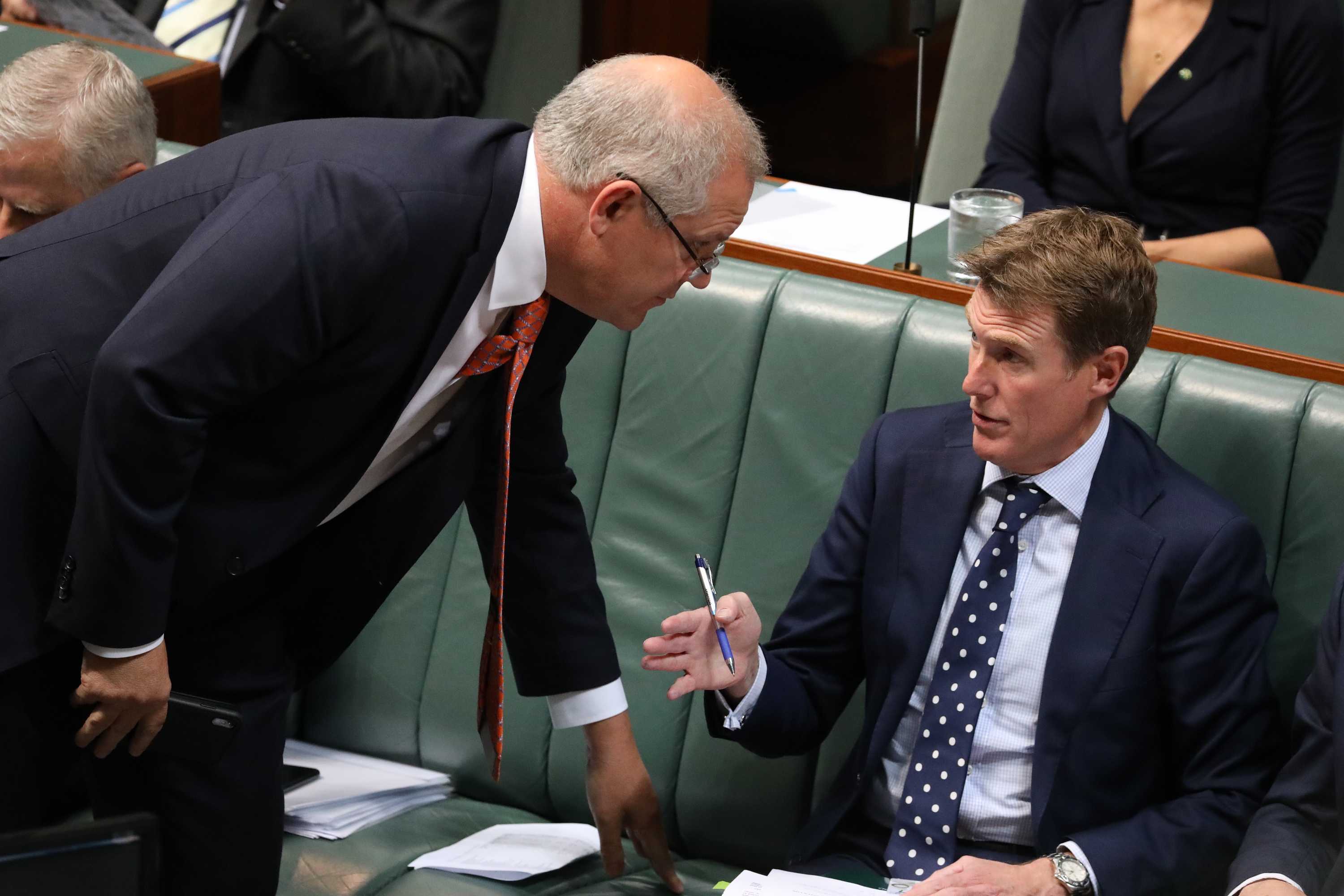 Christian Porter speaks with Scott Morrison in the House of Representatives