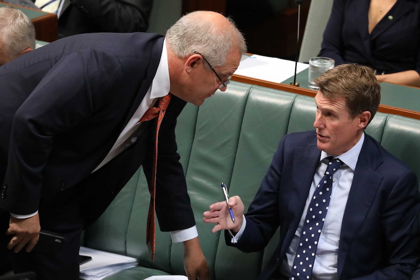 Christian Porter speaks with Scott Morrison in the House of Representatives