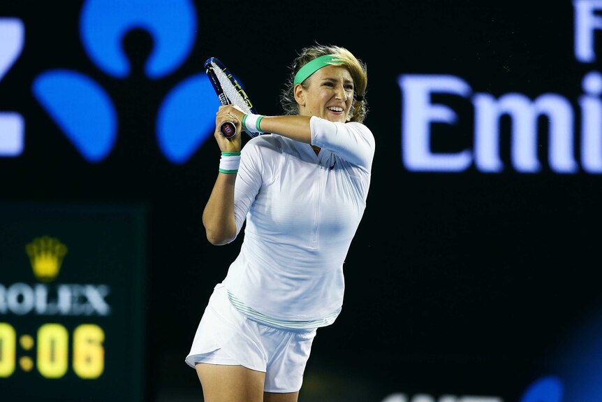 Victoria Azarenka plays a backhand at Australian Open
