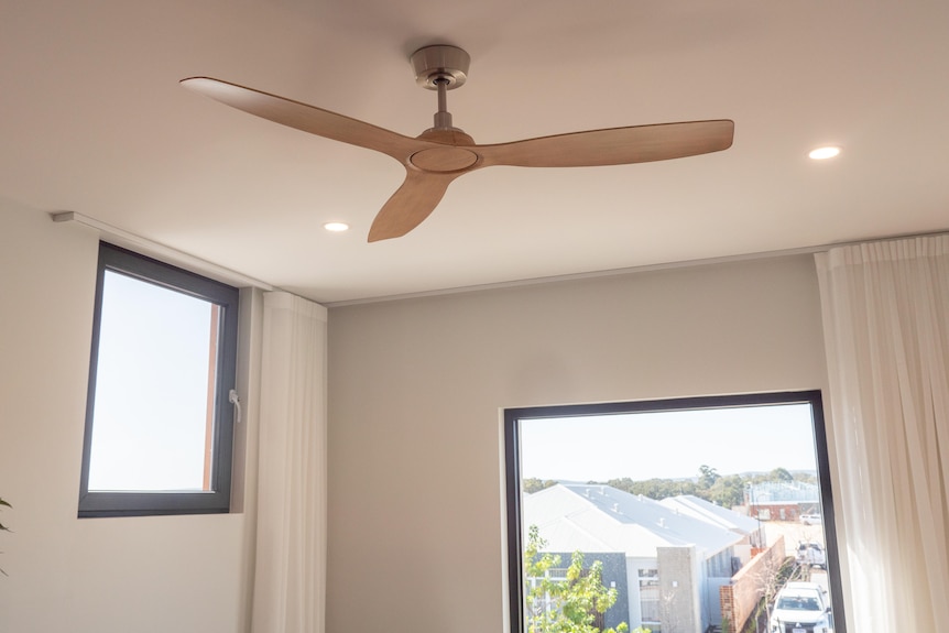 House ceiling fan and window positioning