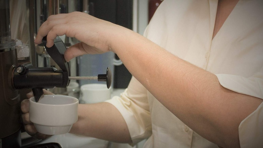 Barista making espresso coffee.