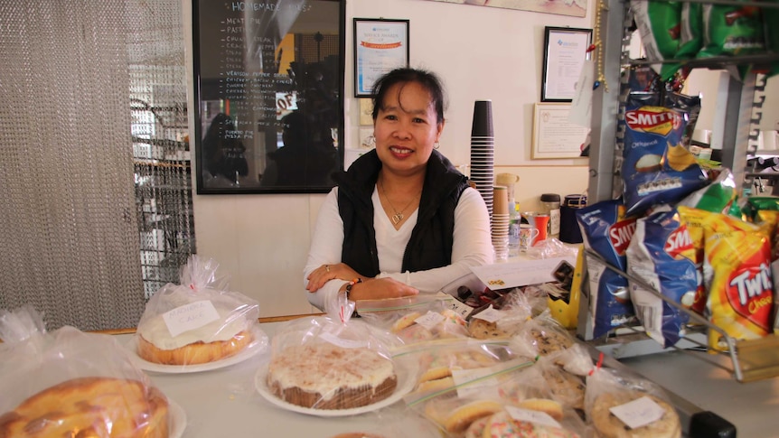 Evelyn McGee serving customers in the bakery.