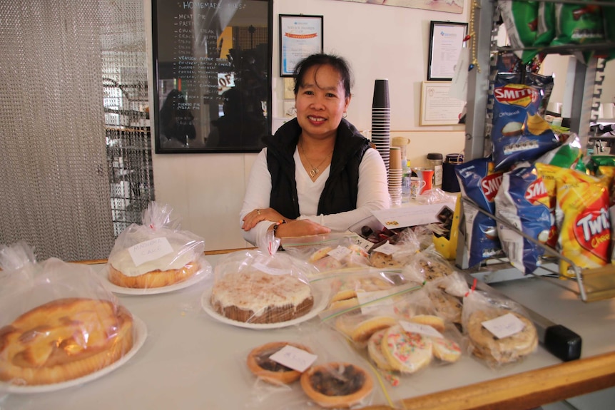 Evelyn McGee serving customers in the bakery.