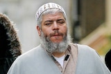 Muslim cleric Sheikh Abu Hamza (2L) outside the North London Mosque, February 2003.