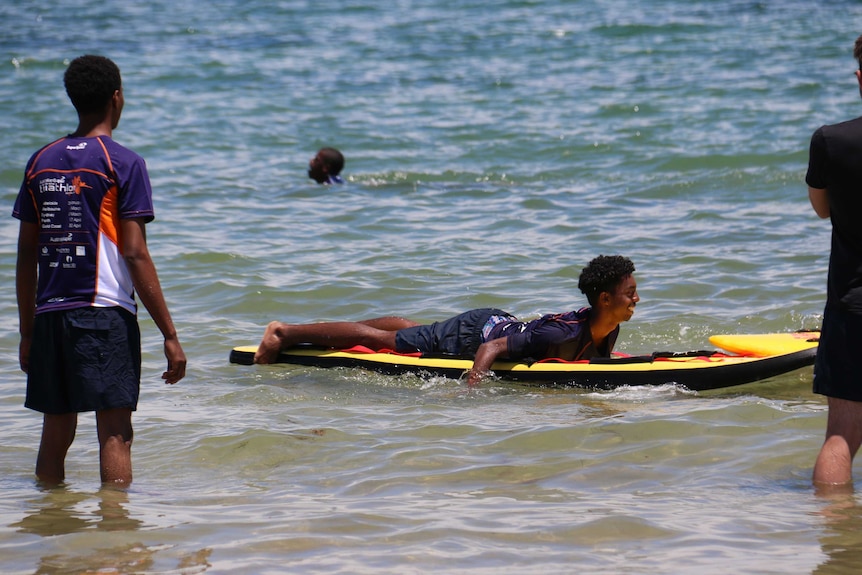 Young man on surf board