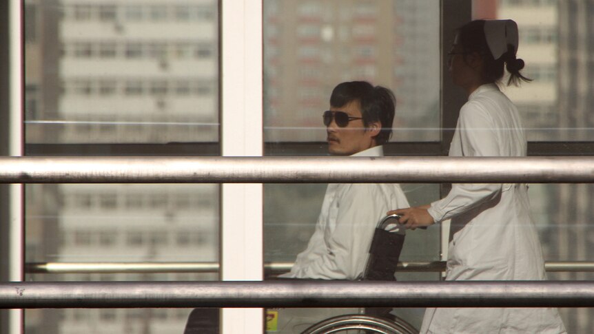 Chinese activist activist Chen Guangcheng in a wheelchair