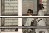 Chinese activist activist Chen Guangcheng in a wheelchair
