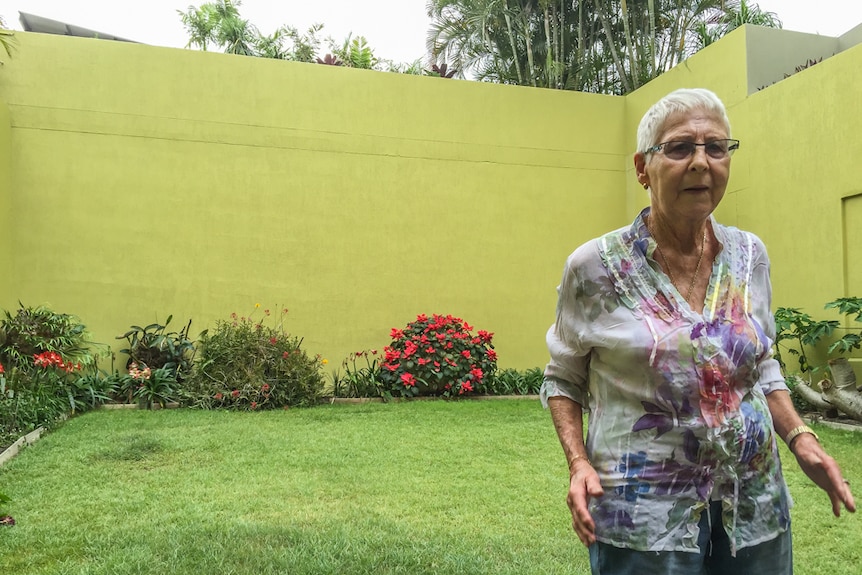 Janet Richards stands in the backyard of her home where she has resided for 60 years.