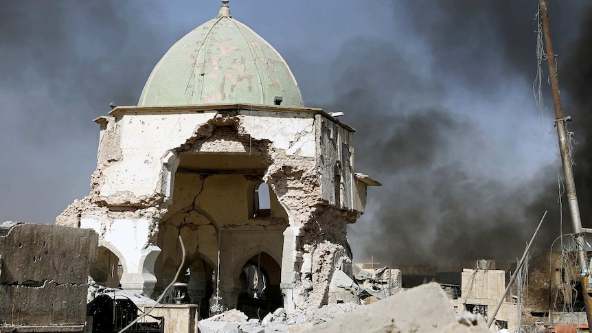 Smoke billows from the ruined Grand al-Nuri Mosque after it was retaken by the Iraqi forces at the Old City in Mosul.
