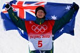 An Australian snowboarder with the Australian flag at the Beijing Winter Olympics.