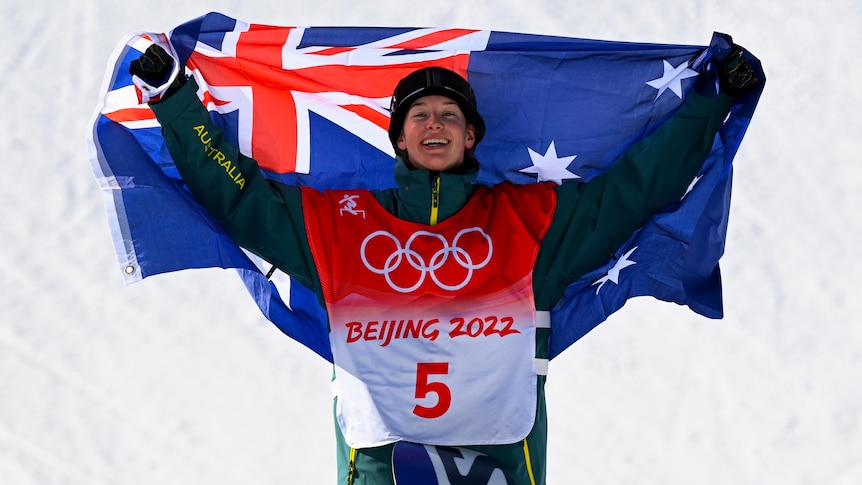 An Australian snowboarder with the Australian flag at the Beijing Winter Olympics.