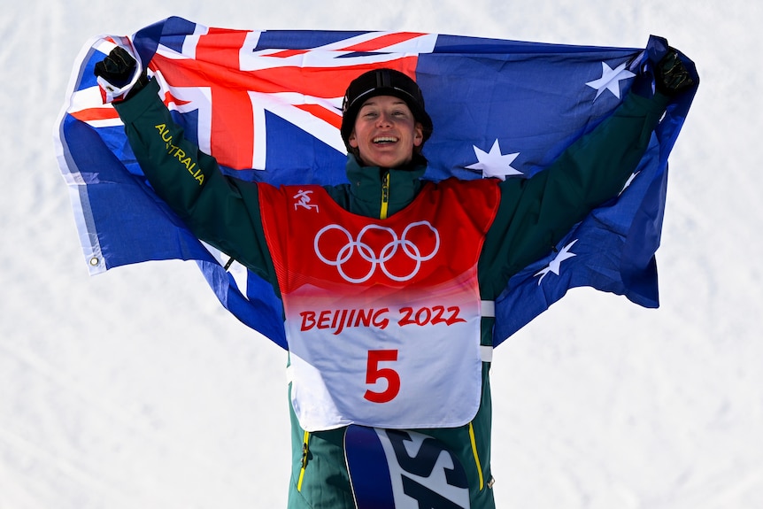 An Australian snowboarder with the Australian flag at the Beijing Winter Olympics.