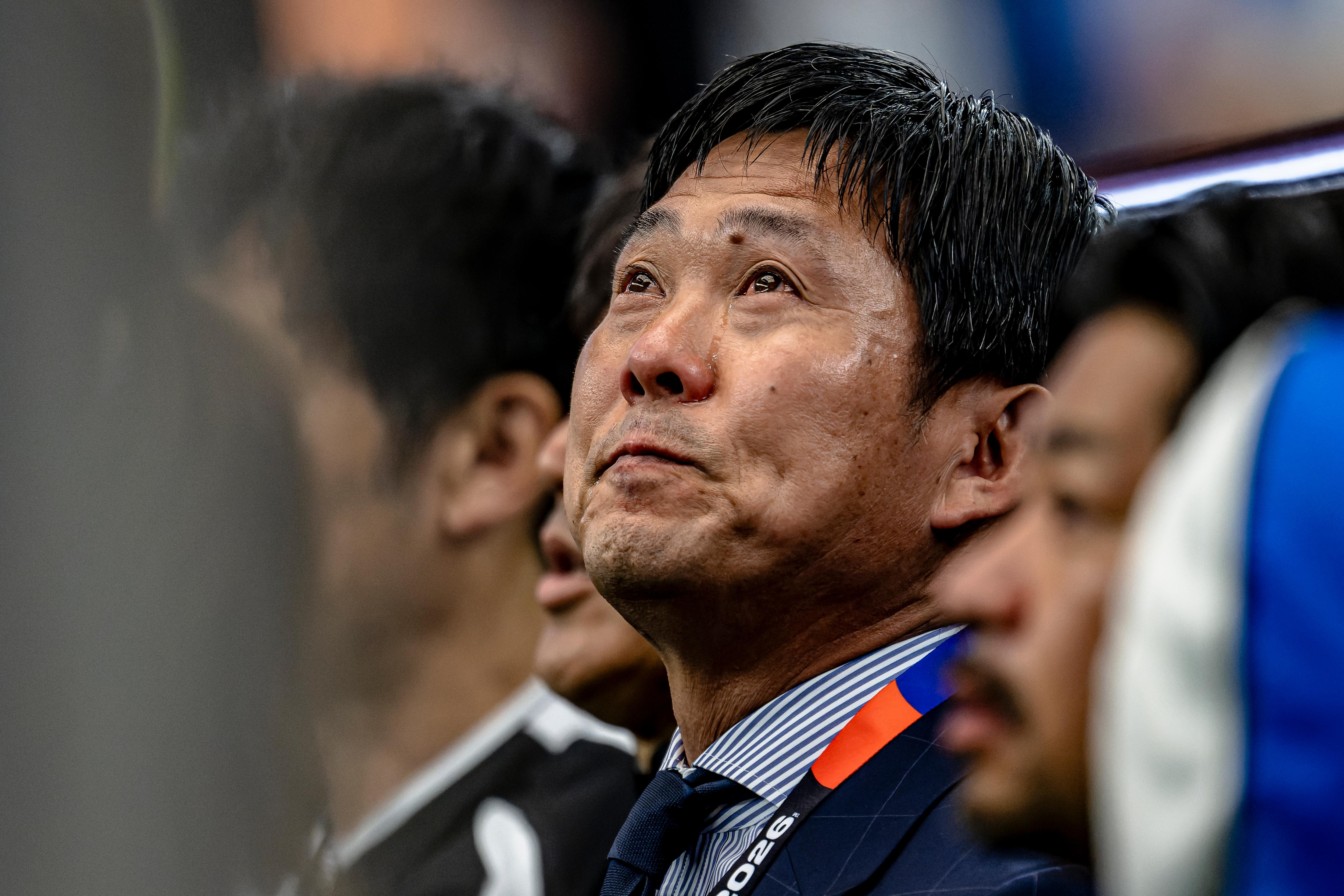 Japan national team coach Hajime Moriyasu is in tears during the national anthem.