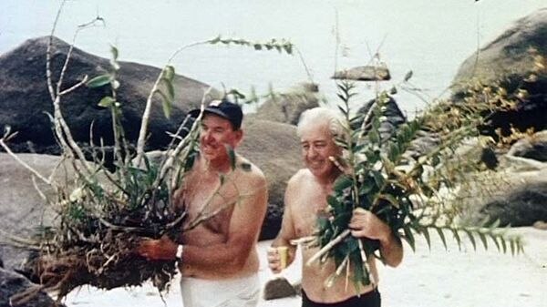 Harold Holt and Bob Dyer collect orchids along a north Queensland beach in 1967.