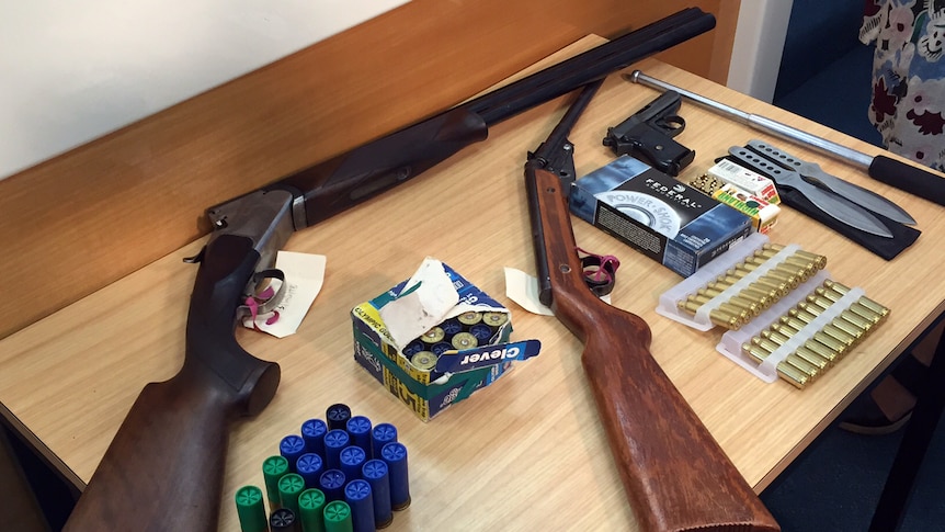 The police raid allegedly netted two 12-gauge shotguns, a semi-automatic pistol, ammunition and throwing knives.