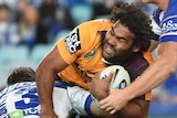 Sam Thaiday is tackled by Bulldogs players