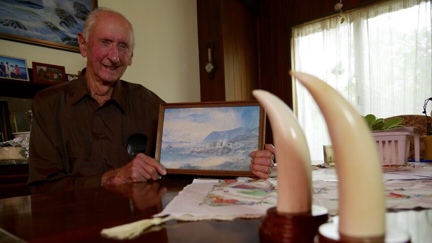 Former whaling station transporter John Rowe at home with ornamental whale teeth