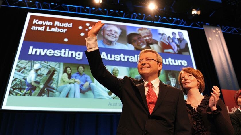 Prime Minister Kevin Rudd waves to delegates alongside Deputy Prime Minister Julia Gillard