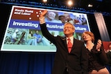 Prime Minister Kevin Rudd waves to delegates alongside Deputy Prime Minister Julia Gillard