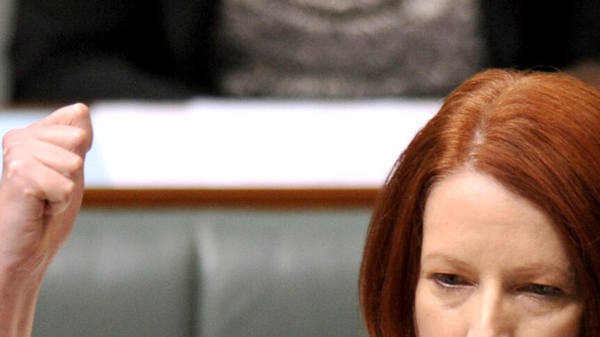 Gillard raises fist in question time