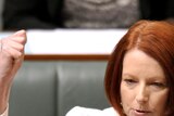 Gillard raises fist in question time