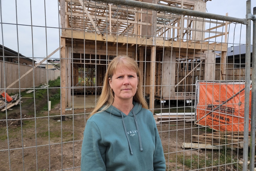 Donna Taylor outside her San Remo land with timber frame behind her, in August 2022